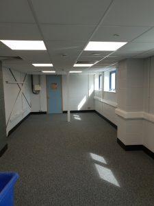 Industrial workspace with new overhead LED lighting installed by Hunter Electrical in Nottingham
